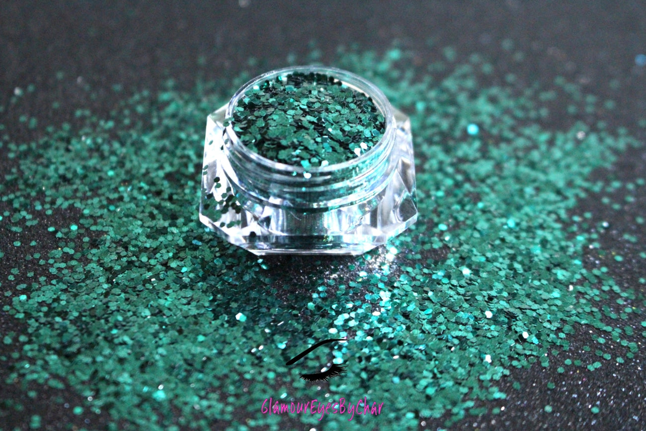 This glitter is called Pining For You and is part of the simple glitter collection.  It consists of pine green glitter. Flake size is larger than fine and extra fine glitter.Pining For You can be used for your face, body, hair and nails.