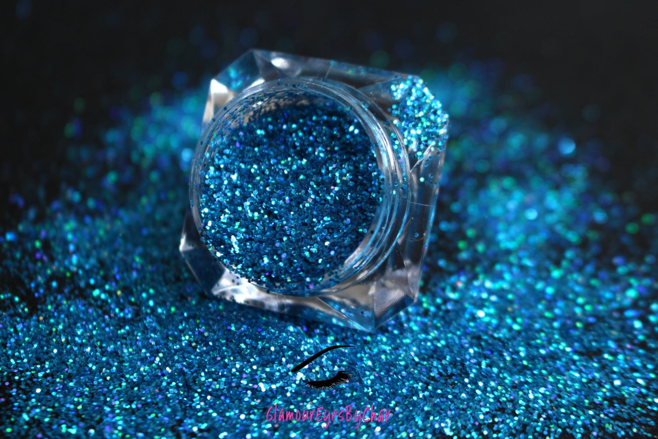 Poolside – Premium Holographic Caribbean Sea Blue Glitter
Part of our Simple Glitter Collection, this glitter shines with holographic Caribbean sea blue sparkle. Poolside is perfect for all your creative looks, nail art, hair, and glitter slime.
Available in 5g jars only.
