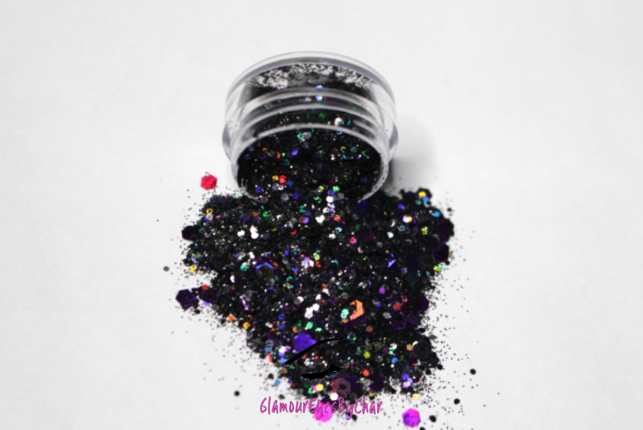 This glitter is called Potion and is part of the super chunky glitter collection.  It consists of black and purple glitter with a holographic sparkle. Potion can be used for your face, body, hair and nails.  Comes in 5g jars only. **Glitter will be discontinued once sold out**