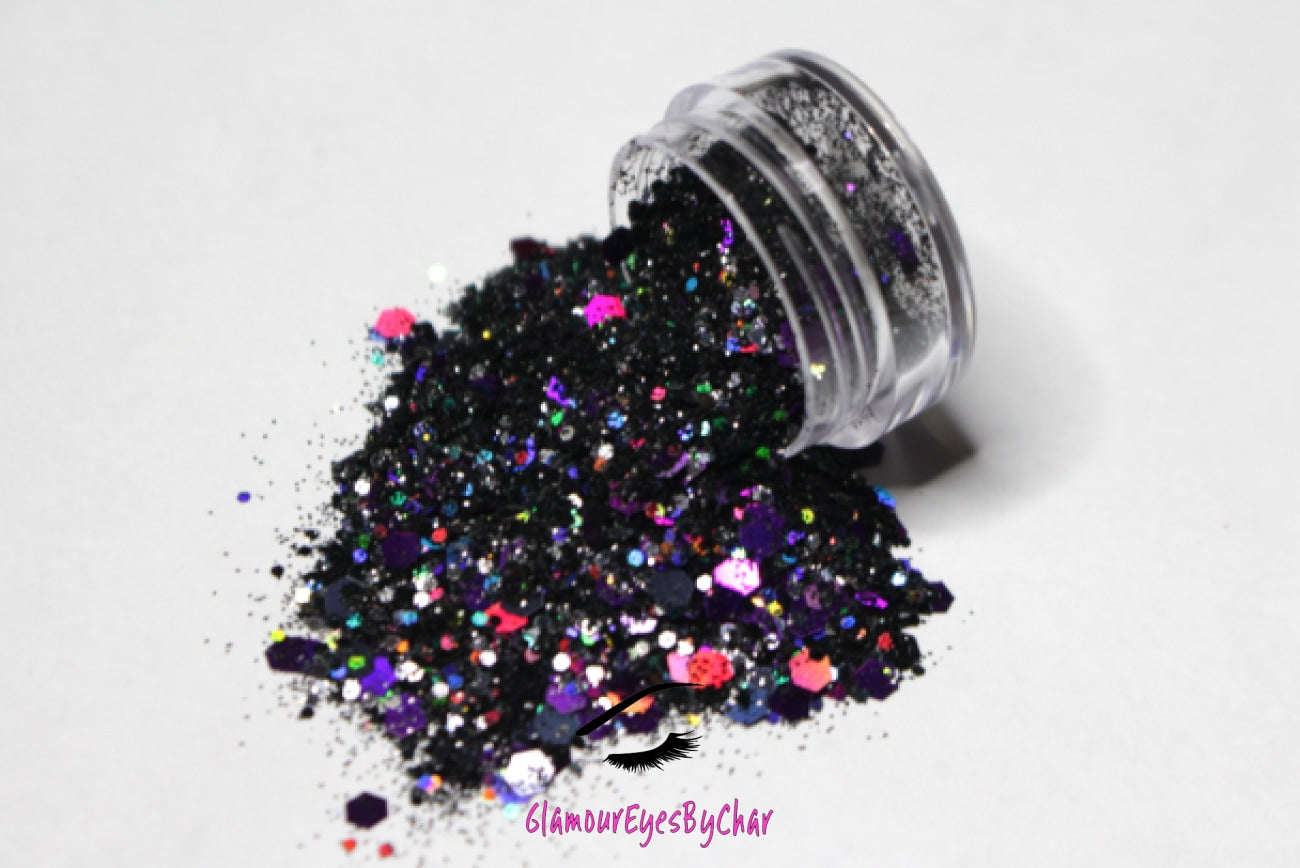 This glitter is called Potion and is part of the super chunky glitter collection.  It consists of black and purple glitter with a holographic sparkle. Potion can be used for your face, body, hair and nails.  Comes in 5g jars only. **Glitter will be discontinued once sold out**