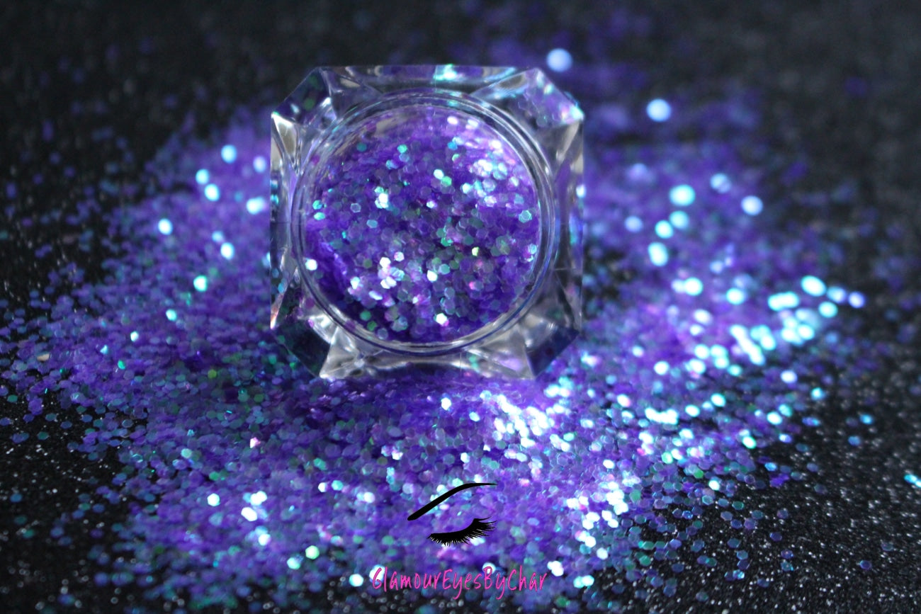 This glitter is called Purple Haze and is part of the simple glitter collection. It consists of purple glitter with an iridescent sparkle. Flake size is larger than fine and extra fine glitter. Purple Haze can be used for your face, body, hair and nails.  Comes in 5g jars only.