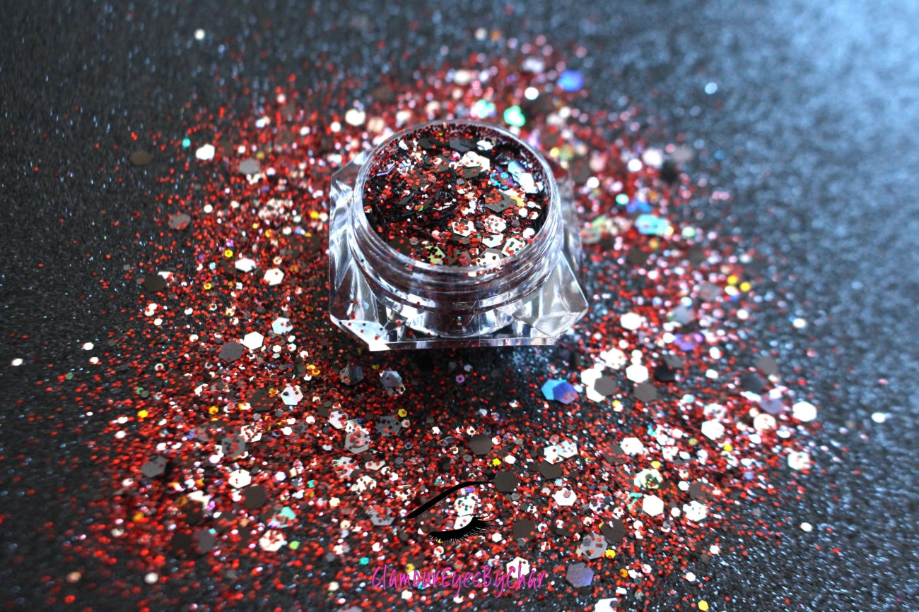 This glitter is called Raptors and is part of the super chunky glitter collection. It consists of ruby red, black, silver, and a touch of gold glitter with a holographic sparkle. If youβre a Toronto Raptors fan, this glitter is perfect for you. Your eyes will stand out in any crowd. Raptors can be used for your face, body, hair and nails. Comes in 5g jars only.