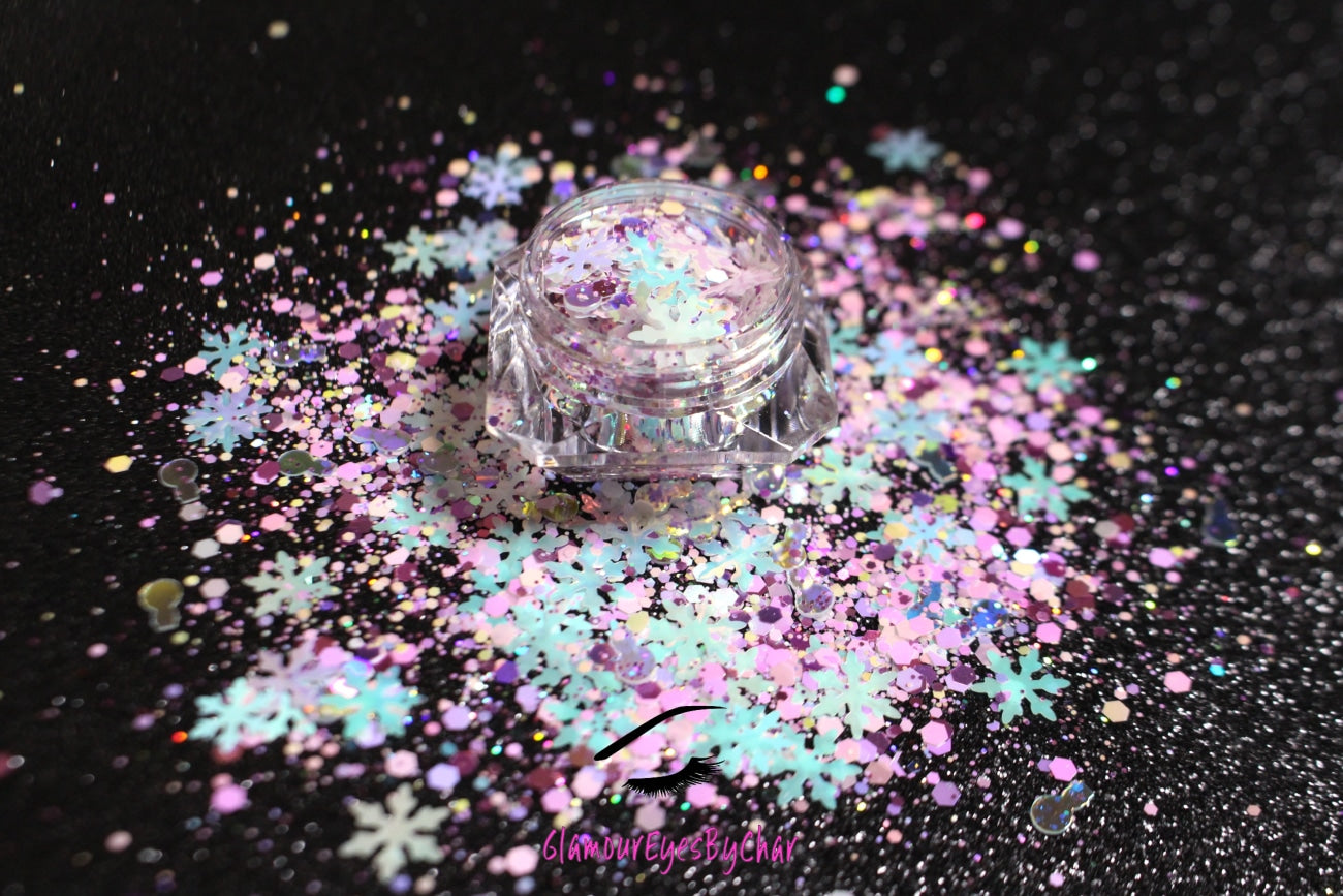Snow Angels – Premium Light Iridescent Pink and Blue Snowflake Glitter Mix
Part of our Holiday Collection, this glitter consists of light iridescent pink and blue snowflakes with white, purple, and silver glitter. Snow Angels is perfect
for nail art and glitter slime.
Available in 5g jars only.