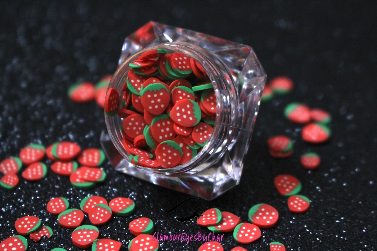 These Strawberry Fruit Slices are PERFECT for 3D nail or body art. They can also be used for a DIY craft project. The fruit slices are made of polymer clay and are approximately 3mm/0.12 inch in size. Comes in 5g jars only. Note: Strawberry Fruit Slices are not recommended for use in the immediate eye area. Tip: Apply some of our glitter to your nails to really GLAMOUREYES your look.