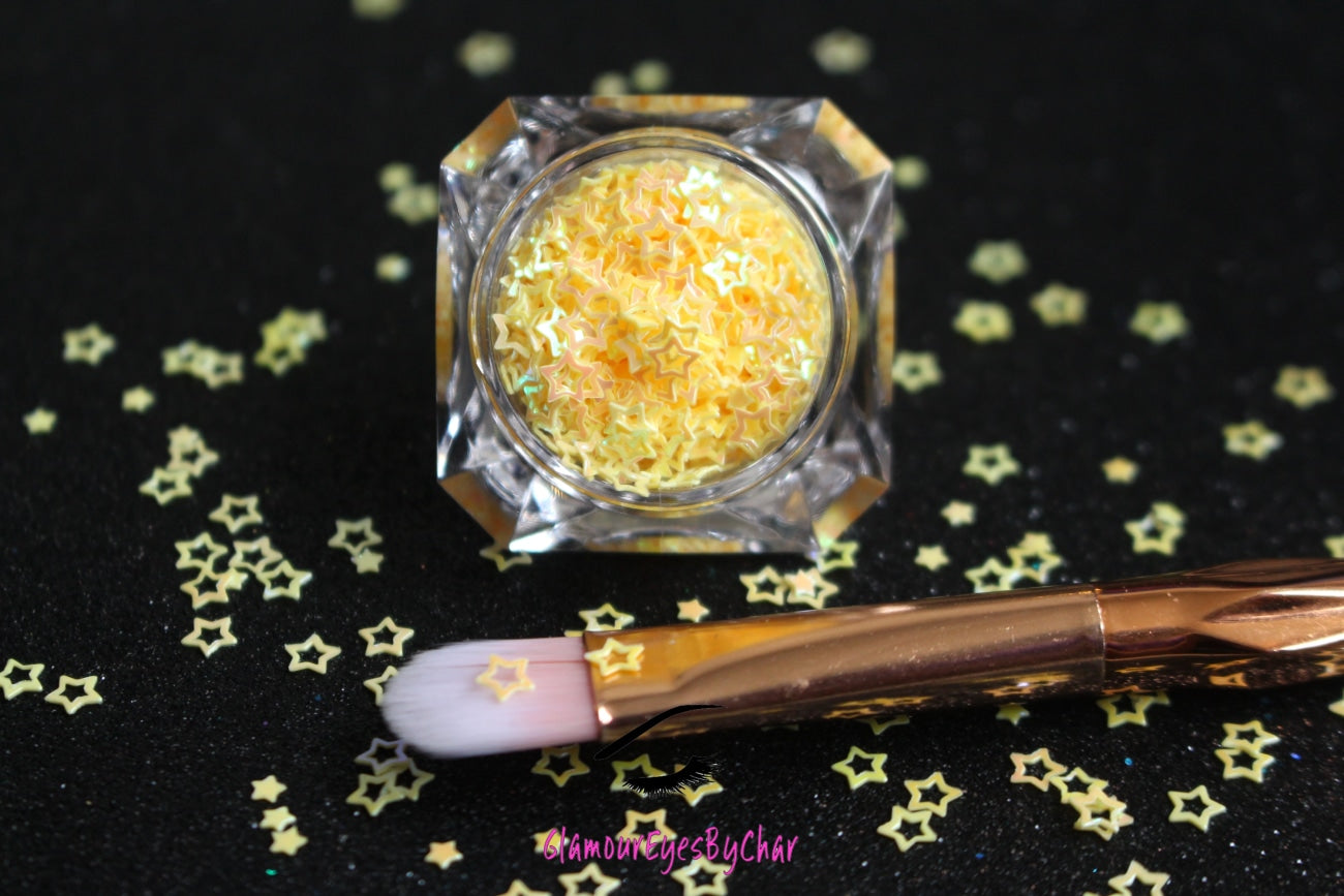 This glitter is called Yellow Stars and is part of the shaped glitters collection. It consists of banana yellow small and large stars with an iridescent sparkle. Yellow Stars is perfect for body and nail art or DIY projects. Comes in 5g jars only. **Glitter will be discontinued once sold out**