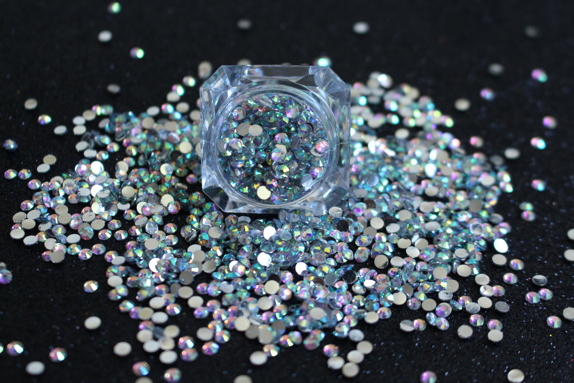 Clear AB Rhinestones – Flatback Resin (2mm &amp; 3mm)
Part of our Glamour Goodies Collection, these clear AB flatback resin rhinestones are perfect for adding extra sparkle to your nails or any creative project. With a brilliant shimmer that catches the light, they bring just the right touch of glam wherever you use them.

Stone size: 2mm and 3mm
Available in 5g and 10g jars.
Note: 10g jars are round and not diamond shaped. Rhinestones are sold by weight and not individually counted.