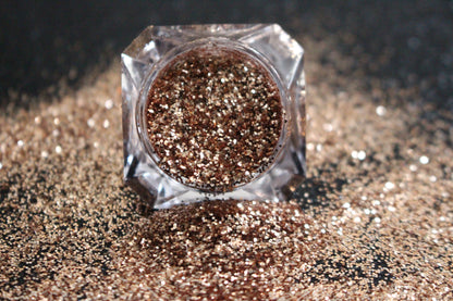 Champagne – Premium Dark Champagne Gold Glitter
Part of our Simple Glitter Collection, this fine glitter shimmers in a rich dark champagne gold tone for an effortlessly elegant touch. Champagne can be used for all your creative looks, nail art, hair, and glitter slime.
Available in 5g jars only.