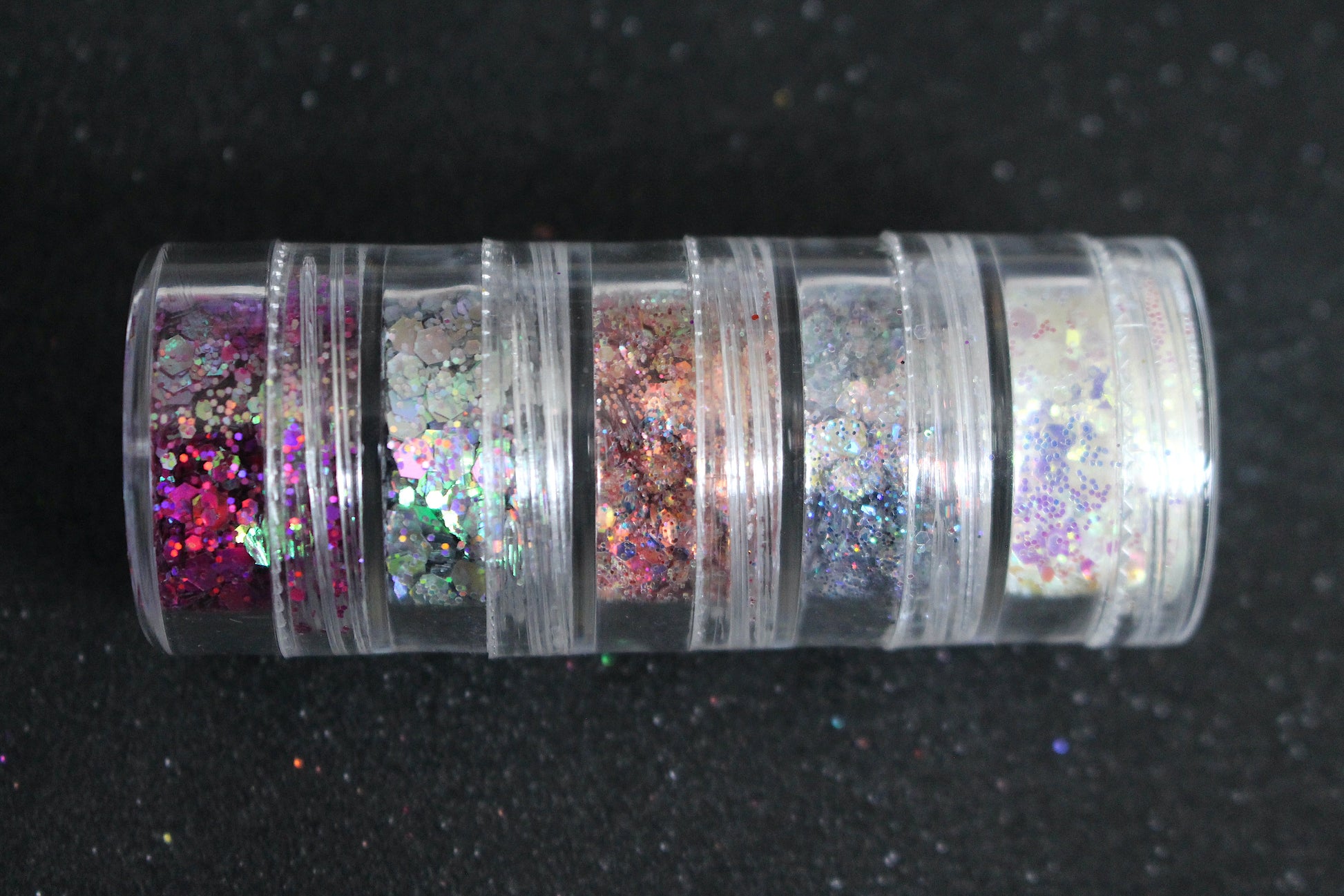 The Dreamland stacker is comprised of dazzling glitters from the super chunky collection. These glitters are perfect for an eye catching look for a night out on the town. The glitters in this set are as follows: Galaxy Illusion She's Perfect Looking Glass Masquerade  The Dreamland stacker can be used for your face, body, hair and nails. Available in 5g jars only. 