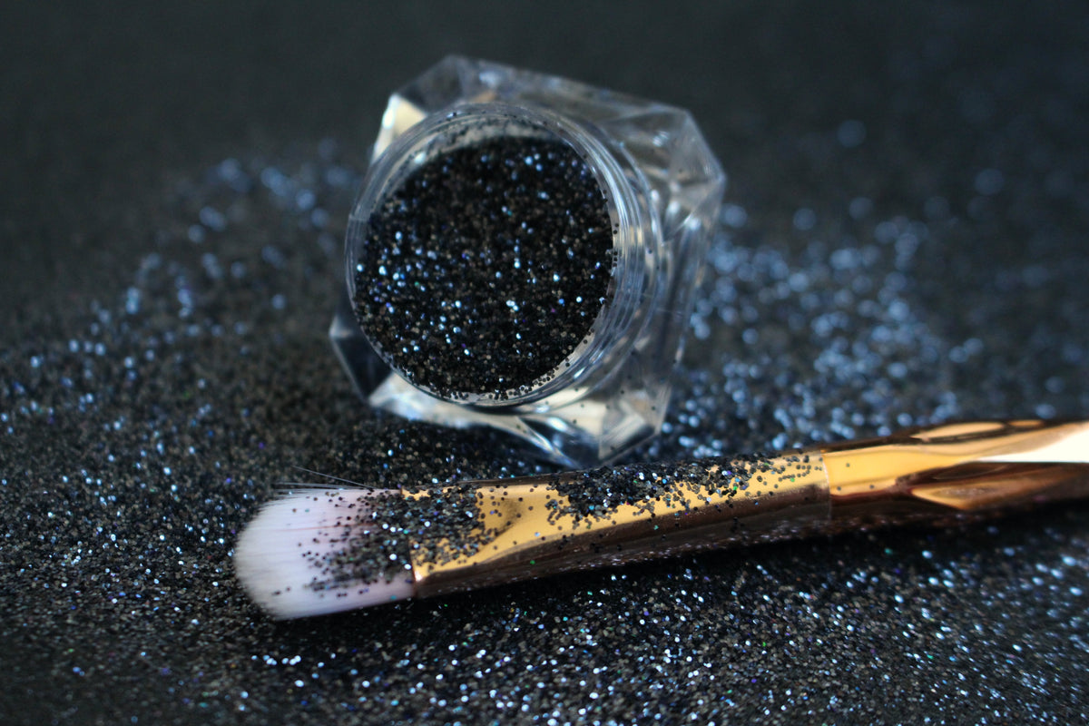 

Graveyard Shift – Premium Holographic Black Glitter
A simple glitter from our Halloween Collection, filled with holographic black sparkle for a dramatic, haunted vibe. Graveyard Shift is perfect for all your creative looks, nail art, hair, and glitter slime.
Available in 5g jars only. 
