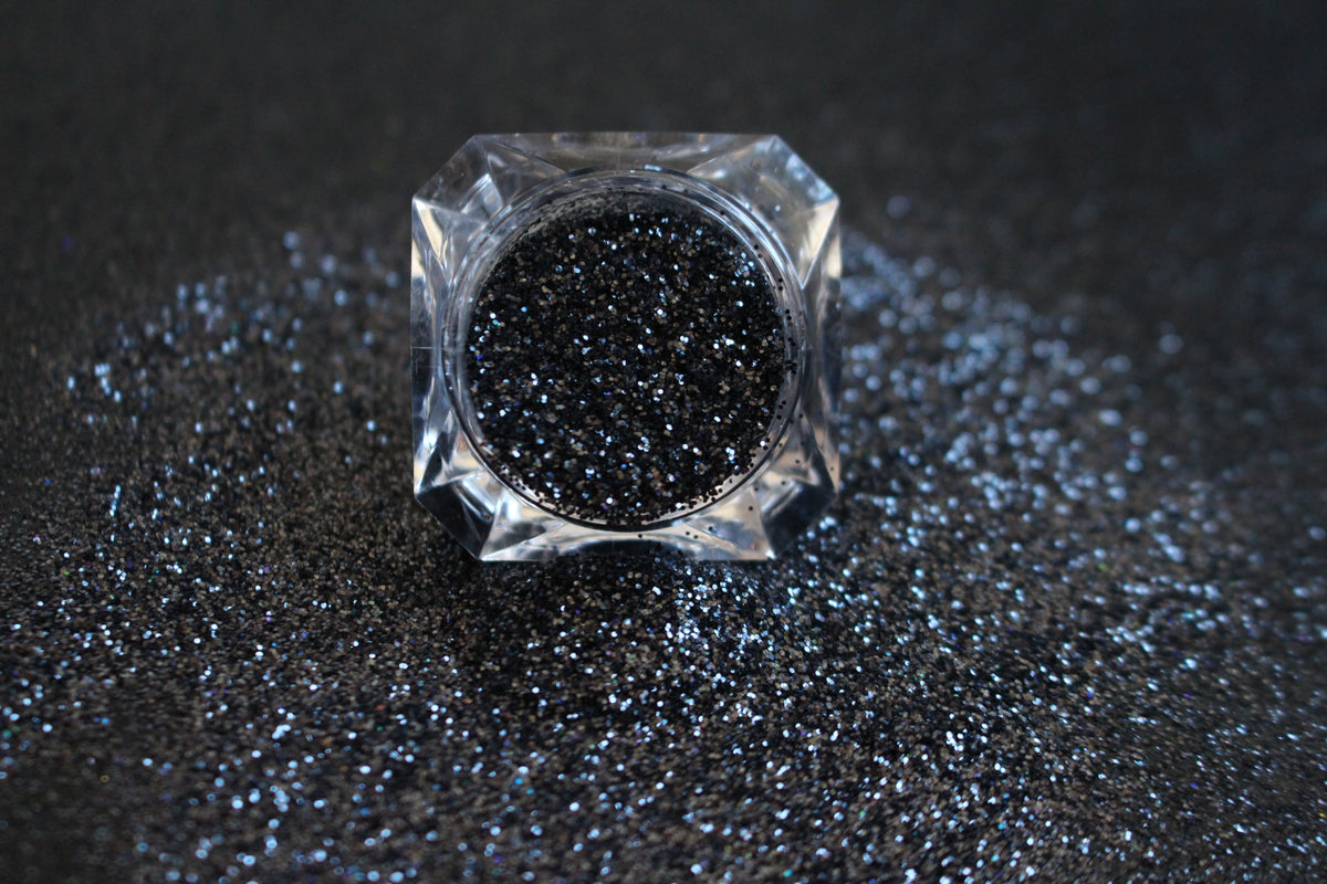

Graveyard Shift – Premium Holographic Black Glitter
A simple glitter from our Halloween Collection, filled with holographic black sparkle for a dramatic, haunted vibe. Graveyard Shift is perfect for all your creative looks, nail art, hair, and glitter slime.
Available in 5g jars only. 