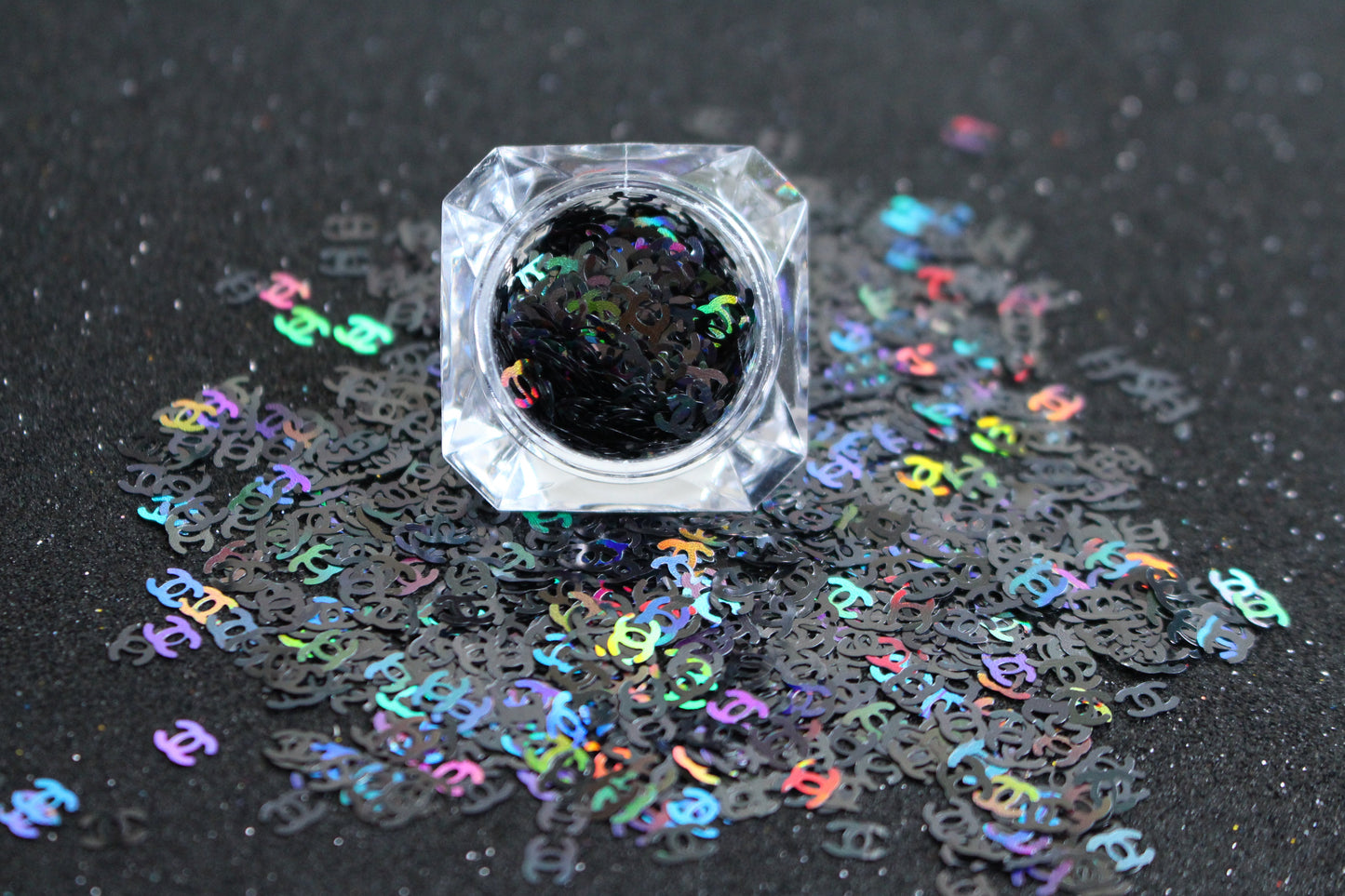 CC Glitter – Premium Chanel-Inspired Holographic Black Letters
Part of our Shaped Glitter Collection, these unique holographic black CC letters add a touch of designer-inspired glam to your nail art and glitter slime.
Available in 5g jars only.
