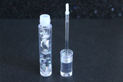 Crystal Clear is a clear handmade hydrating gloss with silver holographic butterflies. This gloss is also vegan, cruelty-free, gluten-free, high shine, smooth and long lasting. It's made with premium rich ingredients to keep your lips soft, moisturized and luscious without feeling sticky. Crystal Clear is available in a squeeze tube and a wand tube (flat doe foot applicator) for a more precise application.