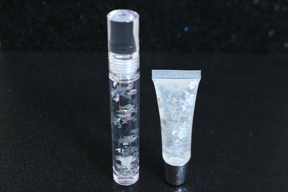 Crystal Clear is a clear handmade hydrating gloss with silver holographic butterflies. This gloss is also vegan, cruelty-free, gluten-free, high shine, smooth and long lasting. It's made with premium rich ingredients to keep your lips soft, moisturized and luscious without feeling sticky. Crystal Clear is available in a squeeze tube and a wand tube (flat doe foot applicator) for a more precise application.