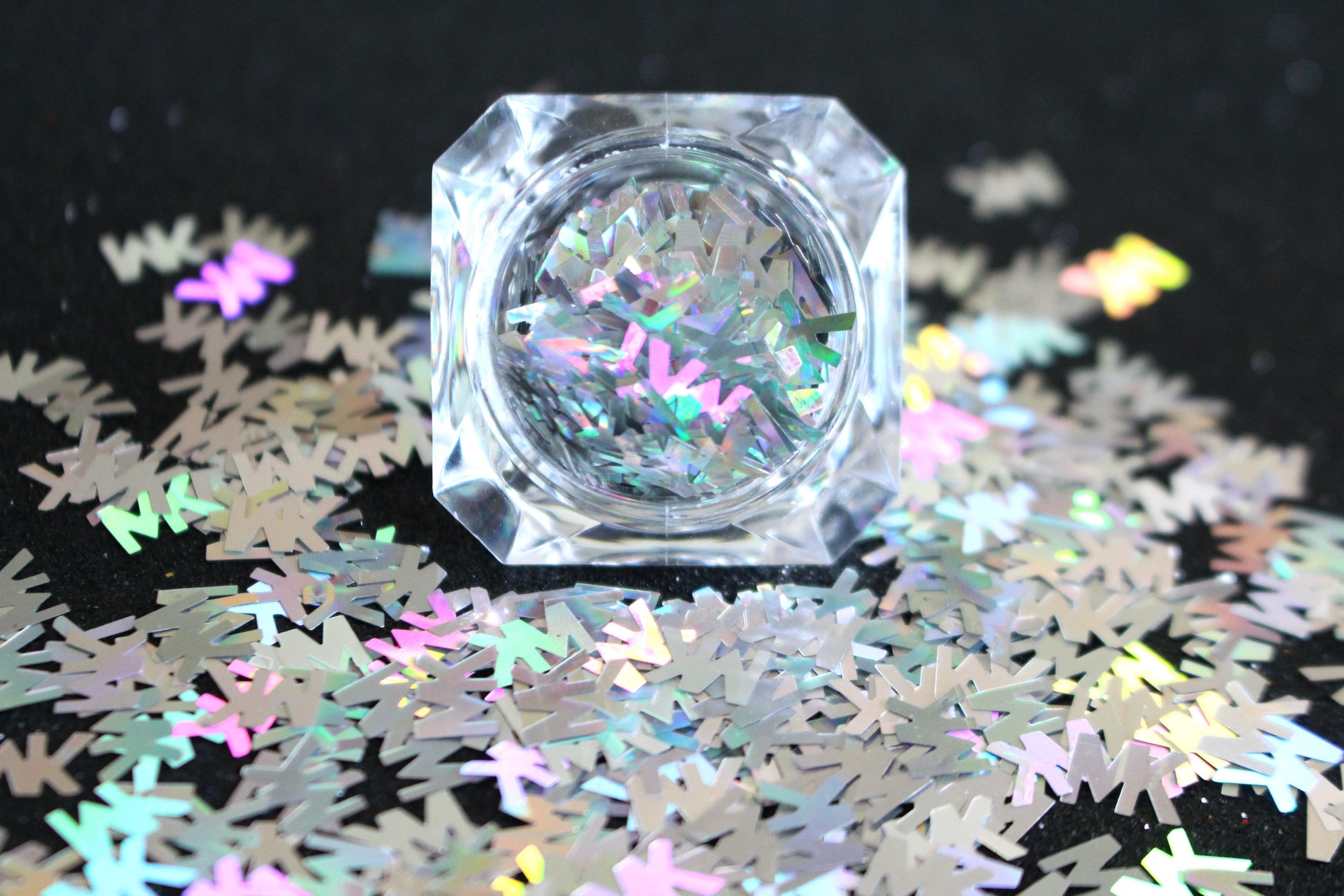 MK Glitter – Premium Michael Kors-Inspired Holographic Silver Letters
Part of our Shaped Glitter Collection, these unique holographic silver MK letters add a chic designer-inspired flair to your nail art and glitter slime.
Available in 5g jars only.