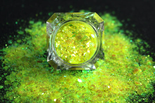 This glitter is called Lemon Lime and is part of the super chunky glitter collection. It consists of fluorescent iridescent green glitter that may look yellow depending on how the light reflects. Lemon Lime can be used for your face, hair, body and nail art, glitter slime, resin art or DIY projects.  Comes in 5g jars only.