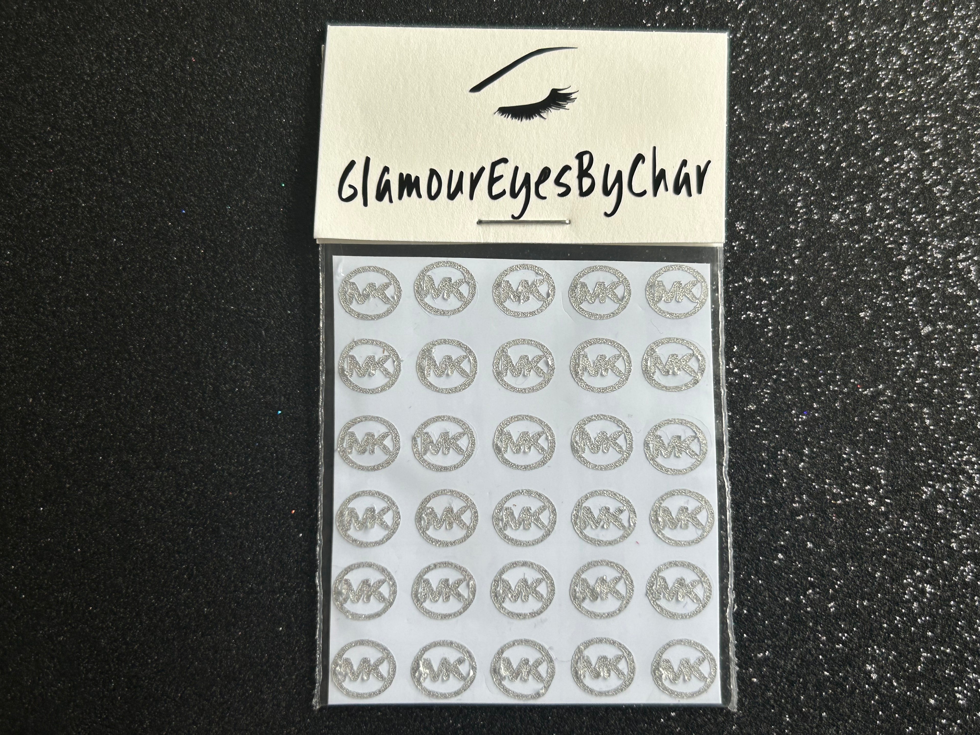 Michael Kors Inspired Nail Stickers – 30 Pieces (7 Colours)
Part of our Nail Sticker Collection, these stylish Michael Kors designer-inspired nail stickers make it easy to spice up your nails at home—no salon needed. Perfect for natural or acrylic nails, they can also be applied over regular polish, gel, or shellac. Handmade with care, these stickers are great for creating chic nail art or adding flair to fun DIY projects.