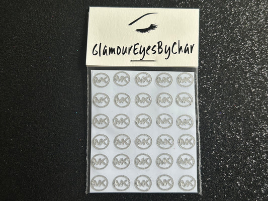 Michael Kors Inspired Nail Stickers – 30 Pieces (7 Colours)
No need to visit the nail salon—spice up your nails at home with these stylish Michael Kors designer-inspired nail stickers. Perfect for natural or acrylic nails, you can apply them over regular polish, gel, or shellac. These handmade stickers also work beautifully for body art and DIY crafts.