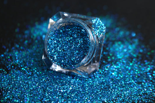 

Poolside – Premium Holographic Caribbean Sea Blue Glitter
Part of our Simple Glitter Collection, this glitter shines with holographic Caribbean sea blue sparkle. Poolside is perfect for all your creative looks, nail art, hair, and glitter slime.
Available in 5g jars only. 