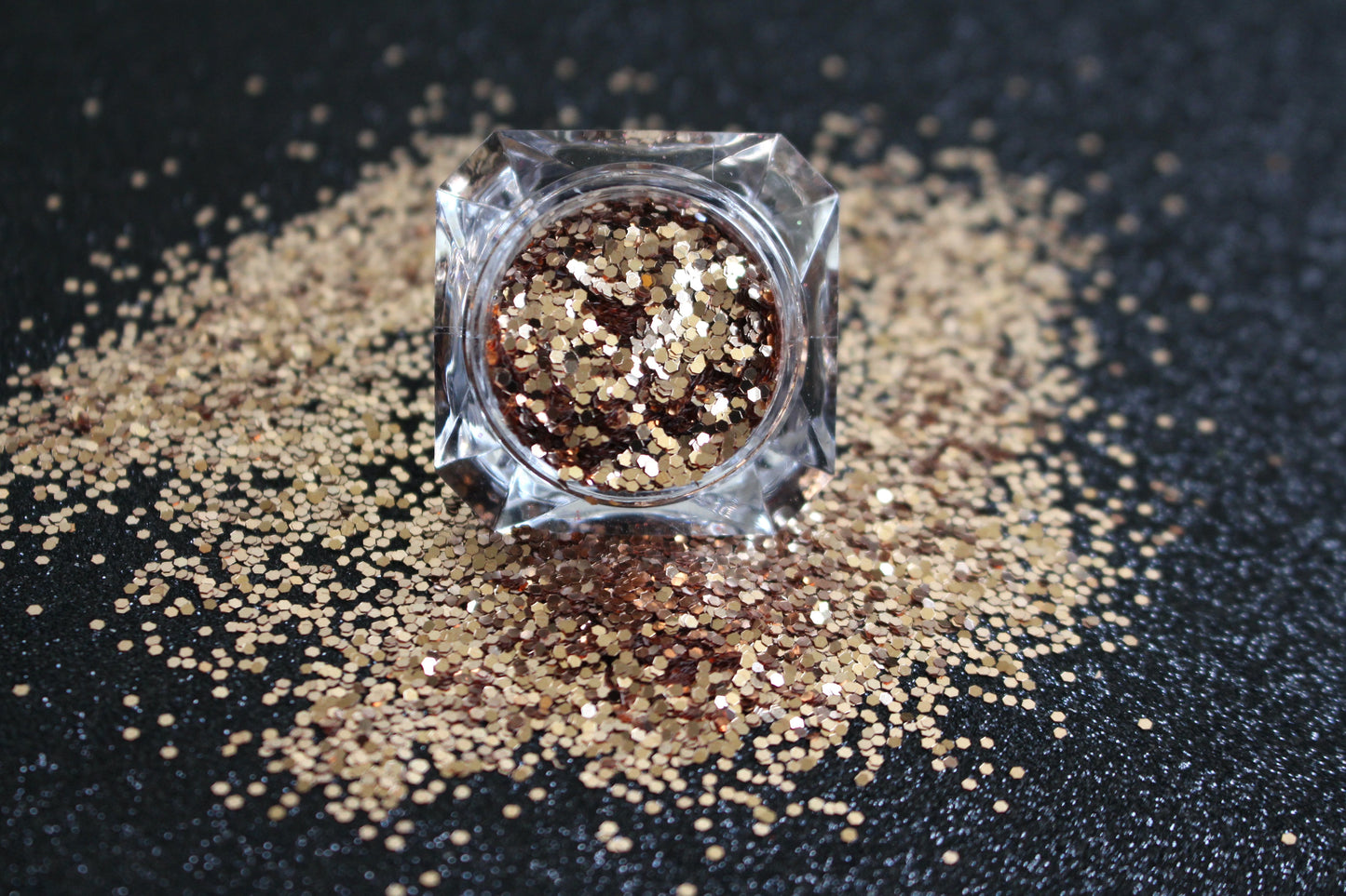 This glitter is called Pot of Gold and is part of the simple glitter collection. It consists of champagne gold glitter with a beautiful sparkle. Flake size is larger than fine and extra fine glitter. Blush can be used for your face, body, hair and nails. Comes in 5g jars only.