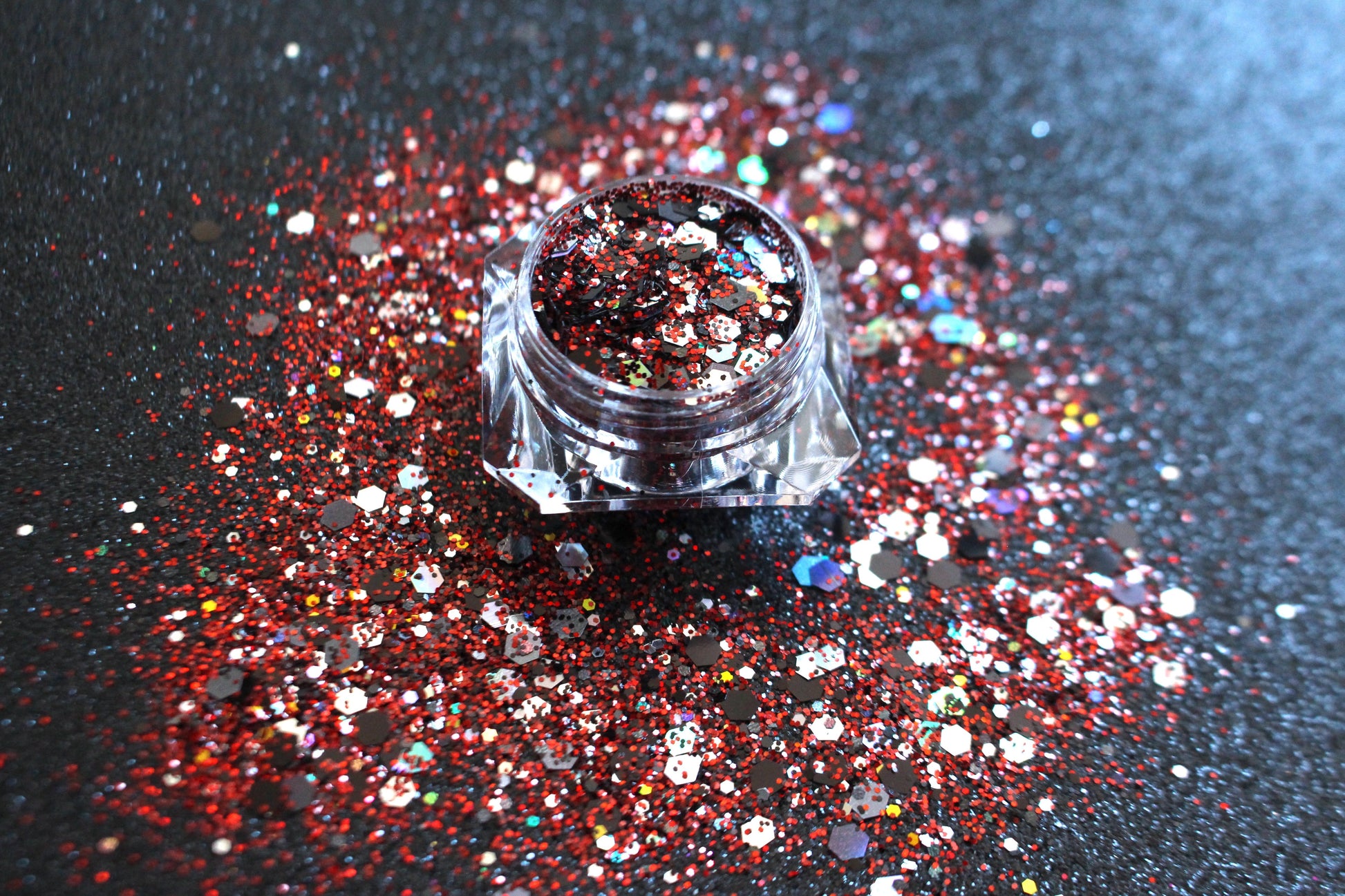 This glitter is called Raptors and is part of the super chunky glitter collection. It consists of ruby red, black, silver, and a touch of gold glitter with a holographic sparkle. If you’re a Toronto Raptors fan, this glitter is perfect for you. Your eyes will stand out in any crowd. Raptors can be used for your face, body, hair and nails. Comes in 5g jars only.