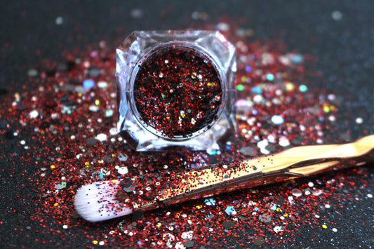 This glitter is called Raptors and is part of the super chunky glitter collection. It consists of ruby red, black, silver, and a touch of gold glitter with a holographic sparkle. If you’re a Toronto Raptors fan, this glitter is perfect for you. Your eyes will stand out in any crowd. Raptors can be used for your face, body, hair and nails. Comes in 5g jars only.