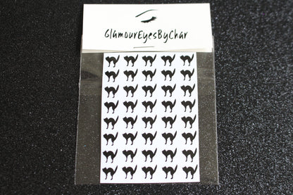 Cat Halloween Nail Stickers – 40 Pieces
Part of our Halloween Collection, these playful cat nail stickers bring just the right mix of spooky and cute to your mani. Apply them to natural or acrylic nails, or layer over polish, gel, or shellac with ease. Handmade with care, they’re also fun for Halloween crafts and DIY projects.

Each pack includes 40 stickers — perfect for hauntingly cute nail art 💅🏾 or spooky DIY fun 🐈.