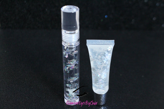 Crystal Clear is a clear handmade hydrating gloss with silver holographic butterflies. This gloss is also vegan, cruelty-free, gluten-free, high shine, smooth and long lasting. It's made with premium rich ingredients to keep your lips soft, moisturized and luscious without feeling sticky. Crystal Clear is available in a squeeze tube and a wand tube (flat doe foot applicator) for a more precise application.