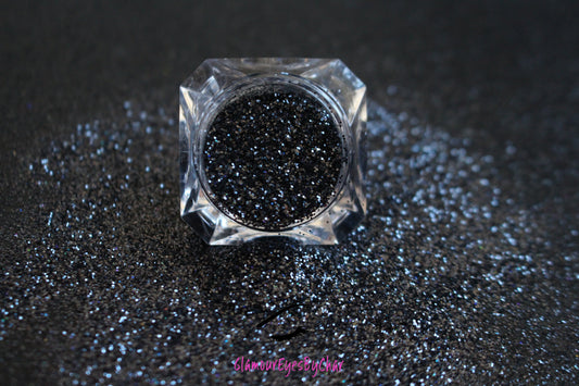 This glitter is called Graveyard Shift and is part of the Halloween glitter collection. It consists of black glitter with a holographic sparkle. Graveyard Shift can be used for your face, body, hair and nails.   Comes in 5g jars only. 