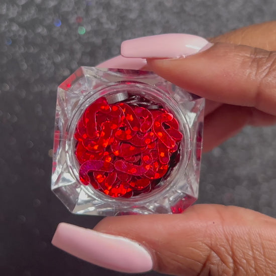 Red Candy Canes – Premium 7mm Glitter Shapes
Part of our Holiday Collection, these festive 7mm ruby red candy canes add a sweet holiday charm to nail art and glitter slime.
Available in 5g jars only.