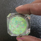 This premium glitter is part of the Glow In The Dark Glitter Collection. It consists of iridescent blue-green glitter with a vibrant green glow. Glow Getter is perfect for nail art and glitter slime. We advise against applying it to the skin. Available in 5g jars only.  Heat resistant  Note: For long-lasting luminescence, simply expose the glitter to light for a few minutes, and watch it glow for hours, adding the perfect touch to your nails.