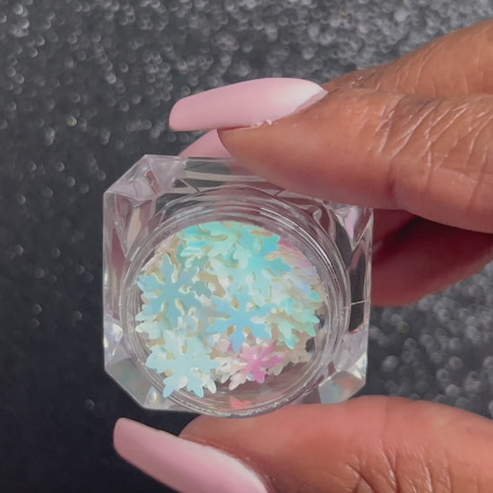 Snowflakes – Premium 9mm Iridescent Glitter Shapes
Part of our Holiday Collection, these delicate 9mm snowflakes shimmer in two enchanting iridescent colours. Perfect for adding a touch of cozy winter magic to nail art and glitter slime.
Available in 5g jars only.