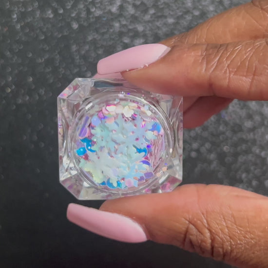 Snow Angels – Premium Light Iridescent Pink and Blue Snowflake Glitter Mix
Part of our Holiday Collection, this glitter consists of light iridescent pink and blue snowflakes with white, purple, and silver glitter. Snow Angels is perfect for nail art and glitter slime.
Available in 5g jars only.