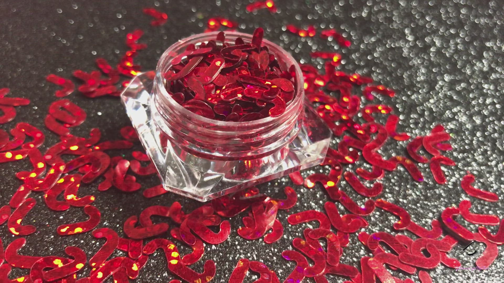 This glitter is called Red Candy Canes and is part of the holiday collection.  It consists of ruby red 7mm candy canes. Red Candy Canes can be used for body and nail art or DIY projects.  Comes in 5g jars only.