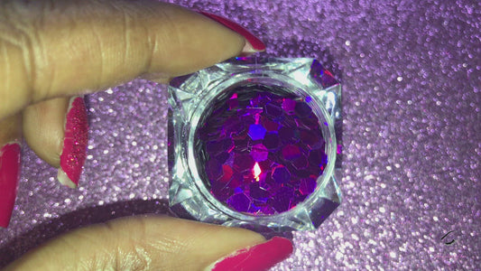 This glitter is called Her Majesty and is part of the simple glitter collection. It consists of dark violet glitter with a holographic sparkle. Flake size is 3mm hex. Her Majesty can be used for your face, body, hair and nails. Comes in 5g jars only. **Glitter will be discontinued once sold out**
