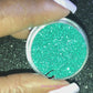 This glitter is called Paradise and is part of the simple glitter collection. It consists of metallic teal simple glitter. Paradise can be used for your face, body, hair and nails. Comes in 5g jars only. **Glitter will be discontinued once sold out**