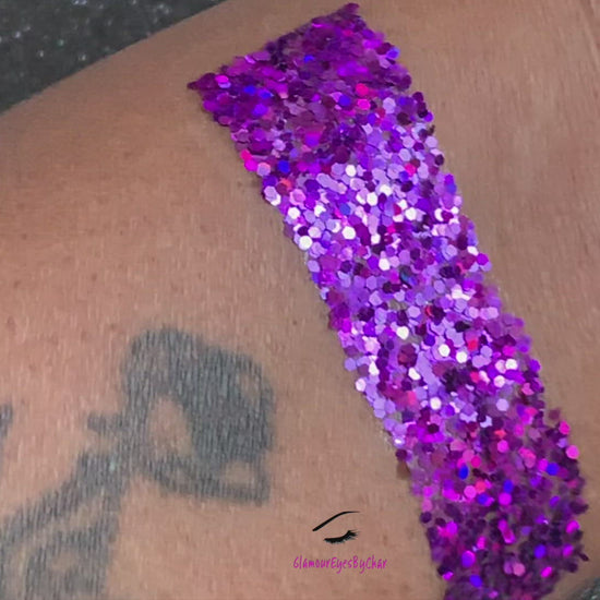 This glitter is called Grapesicle and is part of the simple glitter collection. It consists of dark violet glitter with a holographic sparkle.  Flake size is larger than fine and extra fine glitter.  Grapesicle can be used for your face, body, hair and nails. Comes in 5g jars only.