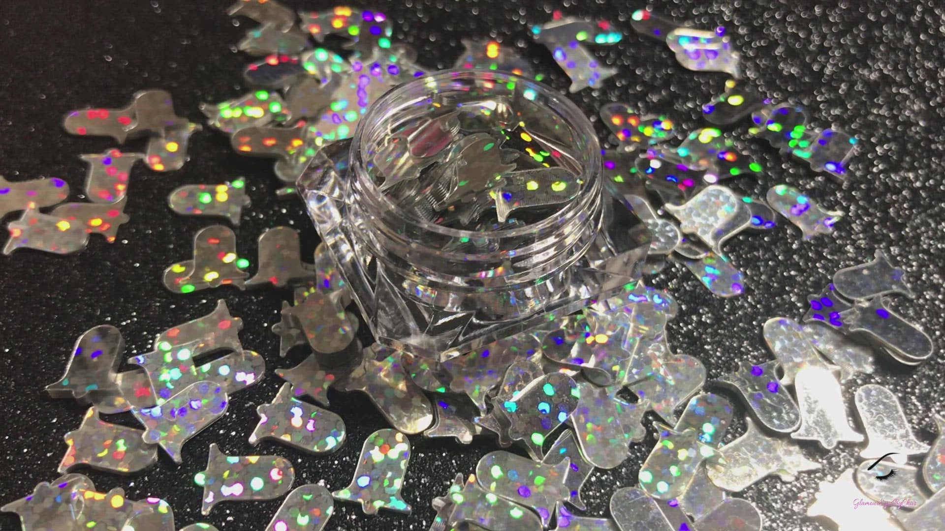 This glitter is called Silver Bells and is part of the holiday collection.  It consists of holographic silver 10mm bells. Silver Bells can be used for body and nail art or DIY projects.  Comes in 5g jars only.  