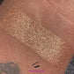 Egyptian Sand Glamlighter is a cool brown bronze shade which has been warmed up with golds and reds. It can be applied as a highlighter or an eyeshadow.