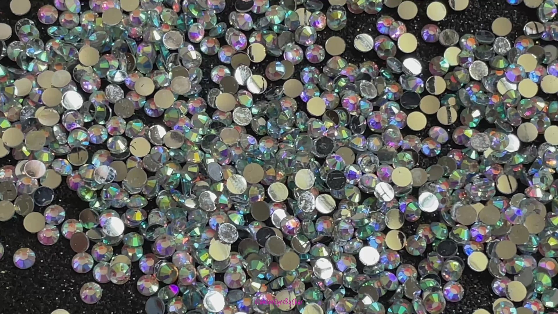 Spice up your nails or makeup look with these clear AB flatback resin rhinestones.  Stone size: 2mm and 3mm Available in 5g and 10g jars.  Note: 10g jars are round and not diamond shaped. Rhinestones are not counted individually and go by the weight of the jar.  Tip#1:  Apply rhinestones with our crystal dual-ended rhinestone picker. The application process will be made quick and easy.