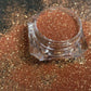 This glitter is called Rich Girl and is part of the simple glitter collection. It consists of light copper metallic glitter. Rich Girl can be used for your face, body, hair and nails. Comes in 5g jars only.