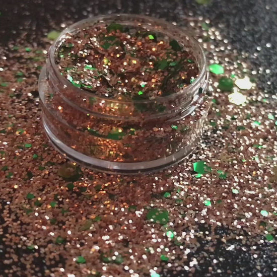 This glitter is called Halo and is part of the holiday collection.  It consists of emerald green and gold glitter. Halo can be used for your face, body, hair and nails.  Comes in 5g jars only.  