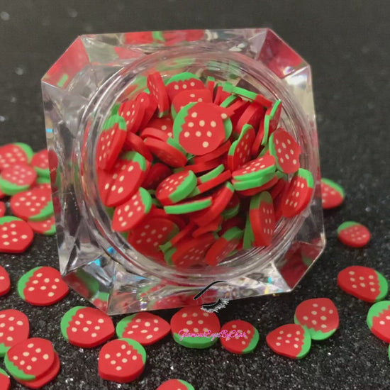 These Strawberry Fruit Slices are PERFECT for 3D nail or body art. They can also be used for a DIY craft project. The fruit slices are made of polymer clay and are approximately 3mm/0.12 inch in size. Comes in 5g jars only. Note: Strawberry Fruit Slices are not recommended for use in the immediate eye area. Tip: Apply some of our glitter to your nails to really GLAMOUREYES your look.