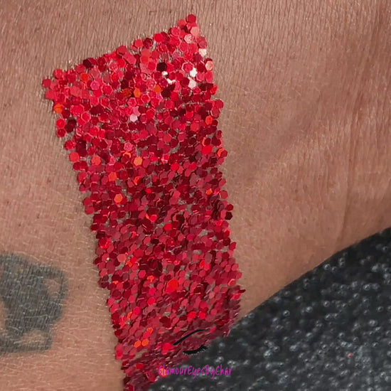 This glitter is called Red Pumps and is part of the simple glitter collection. It consists of ruby red simple glitter. Flake size are larger than fine and extra fine glitter. Red Pumps can be used for your face, body, hair and nails. Comes in 5g jars only.