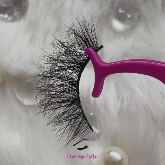 These 5D luxurious mink lashes are called Sassy and are 25mm in length. They are very dramatic, wispy, have a criss cross style, lightweight, and comfortable to wear on the lids. The thin lashband, makes the application process a breeze.  Sassy are suitable for dramatic eye looks and can be worn up to 25 times if handled with care. They are not for timid lash wearers.  Lashes come with a cute bag, and a mascara wand so that you can take care of these beauties.