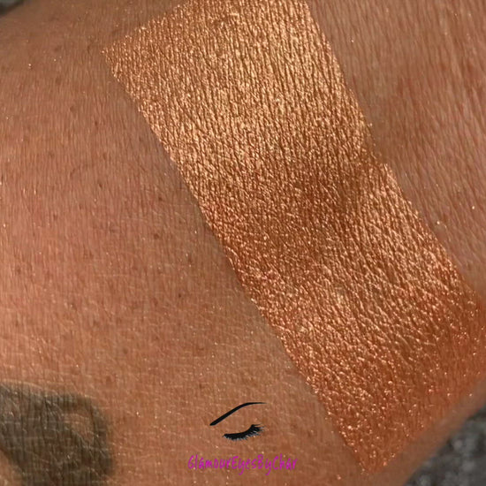  Cleopatra Glamlighter is a copper, gold shade and can be applied as a highlighter or an eyeshadow.   Our handmade pressed glamlighter powder is vegan, pigmented, and silky smooth. It glides right on your skin for an eye catching luminous glow. The buttery formula builds and blends seamlessly without ever looking glittery.