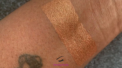  Cleopatra Glamlighter is a copper, gold shade and can be applied as a highlighter or an eyeshadow.   Our handmade pressed glamlighter powder is vegan, pigmented, and silky smooth. It glides right on your skin for an eye catching luminous glow. The buttery formula builds and blends seamlessly without ever looking glittery.