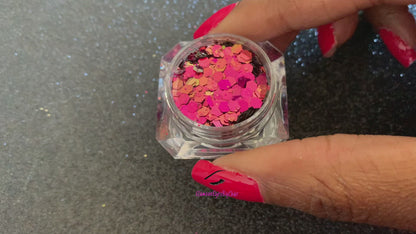 This chameleon glitter is called Fantasy and is part of the super chunky glitter collection. It consists of berry glitter with a gold and green unique colour shifting sparkle. Fantasy can be used for your face, body, hair and nails.  Comes in 5g jars only.