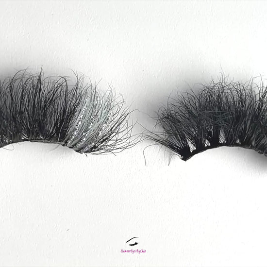 These 5D  premium mink lashes are 25mm in length. They are dramatic, fluffy lightweight, and comfortable to wear on the lids. They have a pop of silver glitter and colour to add an extra sparkle to your eyes. The flexible cotton lash band, makes the application process a breeze.  Stormy lashes are suitable for bold eye looks, and you can wear this reusable style up to 25 times if handled with care. They will definitely make your eyes pop, but are not for timid lash wearers. 