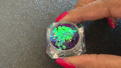 This chameleon glitter is called Mesmerize and is part of the super chunky glitter collection. It consists of dark purple glitter with a blue and green unique colour shifting sparkle. Mesmerize can be used for your face, body, hair and nails.  Comes in 5g jars only.