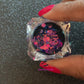 This chameleon glitter is called Hypnotic and is part of the super chunky glitter collection. It consists of dark pink glitter with a purple and teal unique colour shifting sparkle. Hypnotic can be used for your face, body, hair and nails.  Comes in 5g jars only.